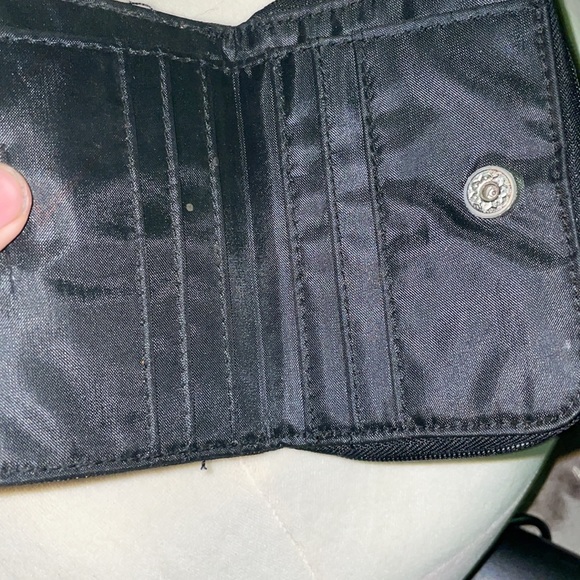 It’s a tinker bell wallet a broken button so not that much - Picture 3 of 4